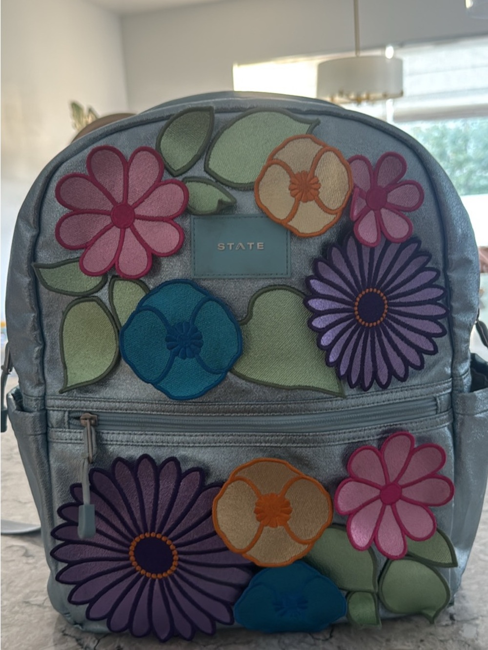 STATE Silver Backpack with Colorful Floral Patches